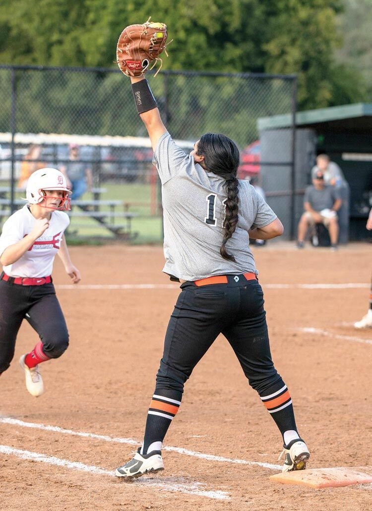 Mayce Trejo stretches to grab the ball and get the out. The Wayne Lady Bulldogs are hosting Elmore City for District play today (Thursday) at noon and 2 p.m.