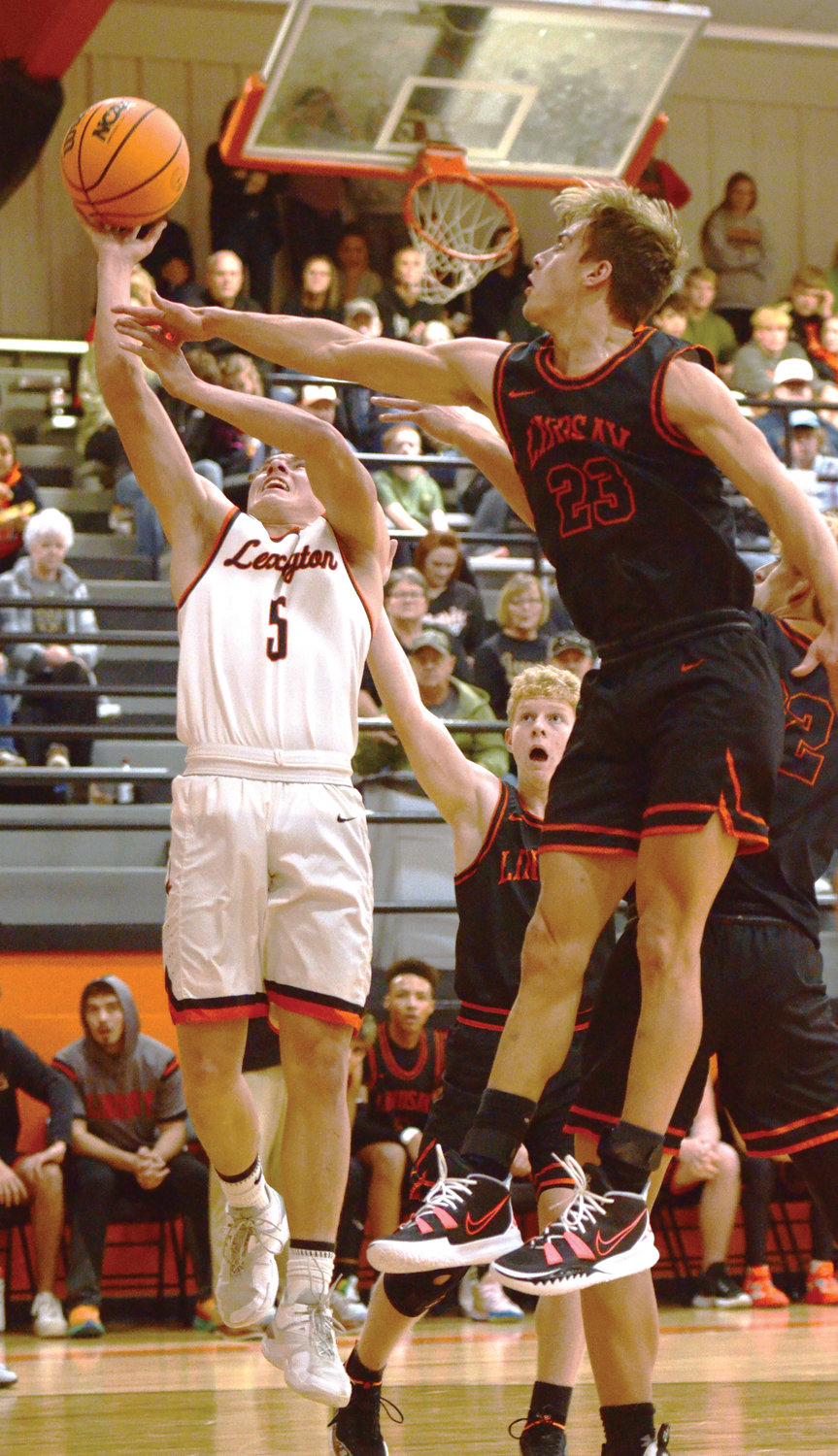 Lexington senior Heath Winterton shoots a layup in the paint during the Bulldogs’ game against Lindsay. Lexington fell to the Leopards 42-34. Winterton scored three points.