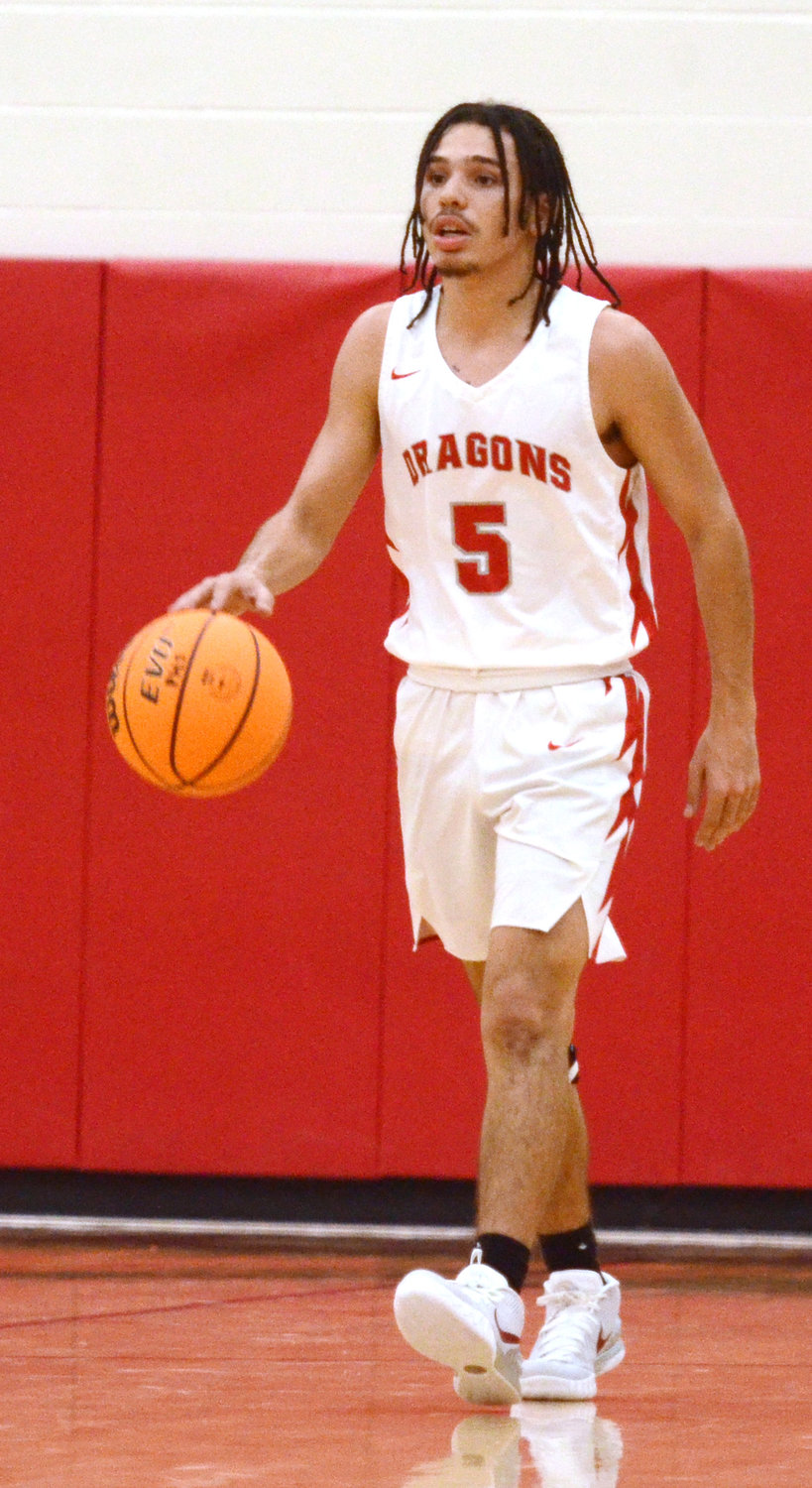 Purcell junior Malachi Evans dribbles the ball up the floor for the Dragons. Evans led Purcell with 19 points in their 69-59 win over Harding Prep last Saturday.