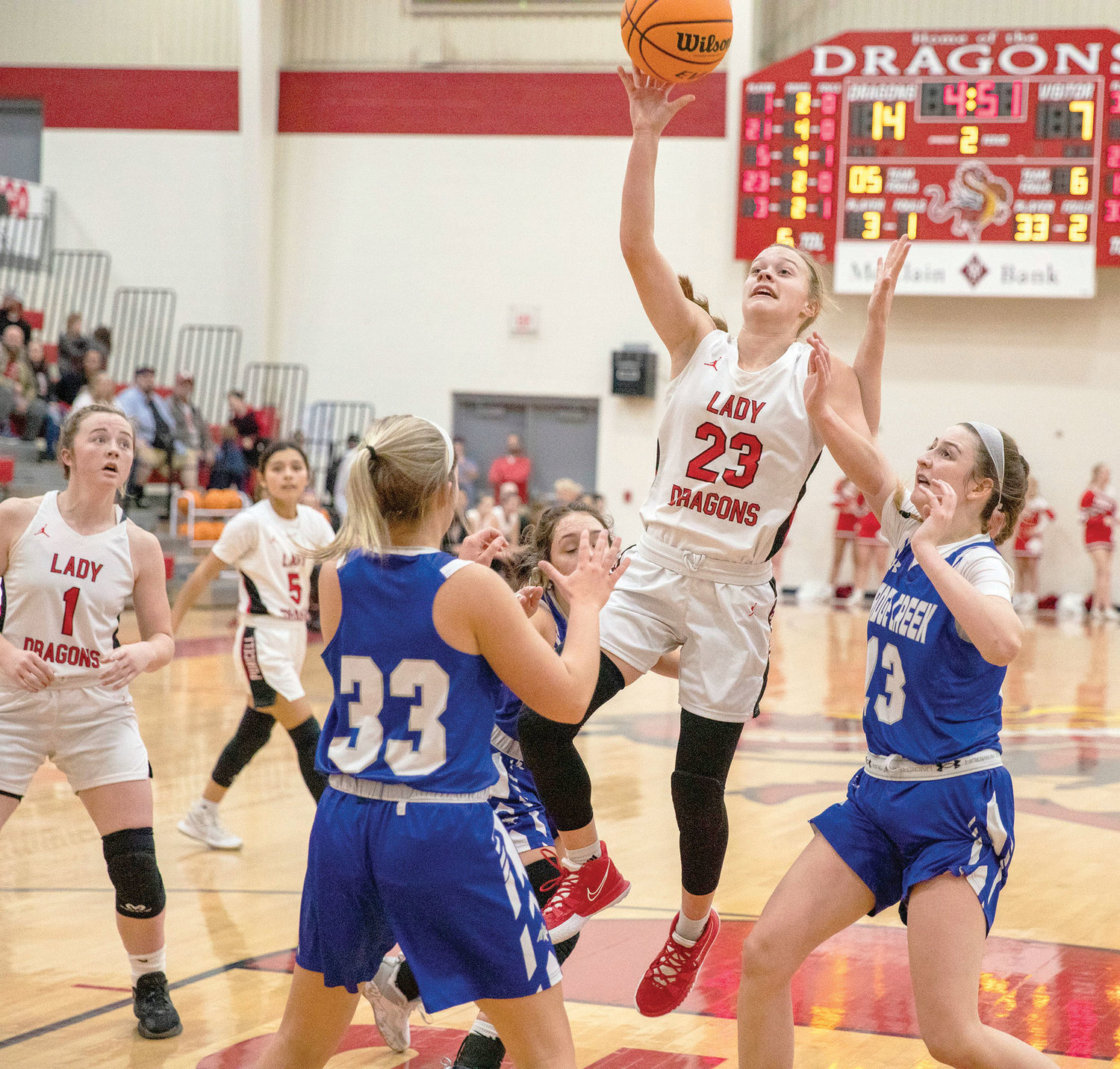 Purcell freshman Hadleigh Harp shoots a ball in the lane against Bridge Creek on January 4. Harp scored four points in the 51-34 Dragon win.