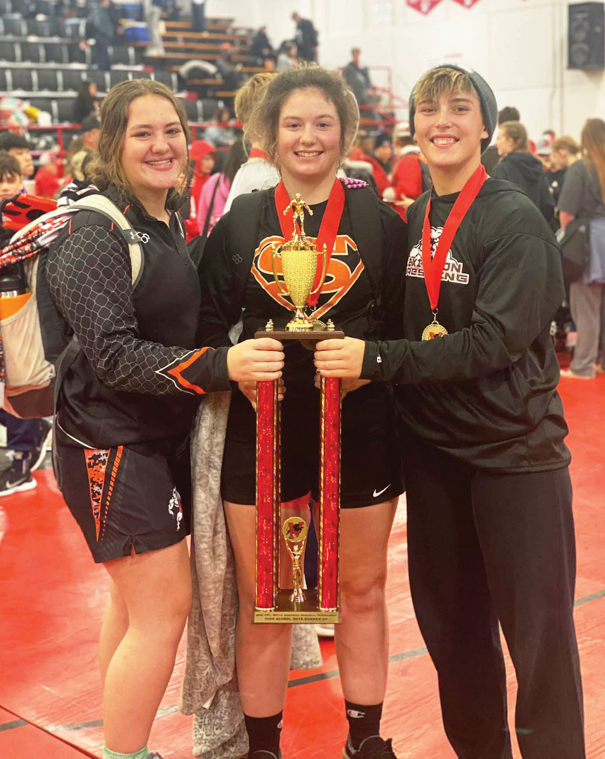 The trio Elexa Collins, Cilee Turner and Izzy Pack hoisted the Pauls Valley team runner-up trophy last weekend.