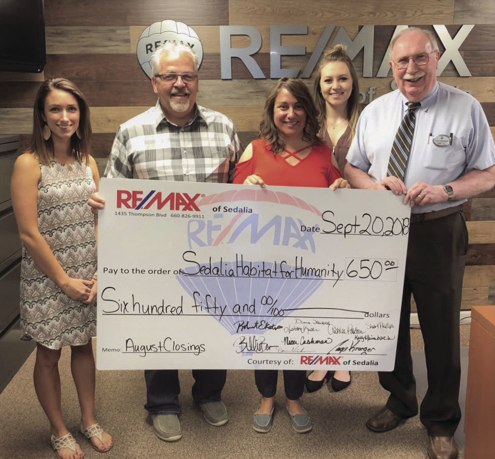 RE/MAX of Sedalia donates to Habitat for Humanity Sedalia Democrat